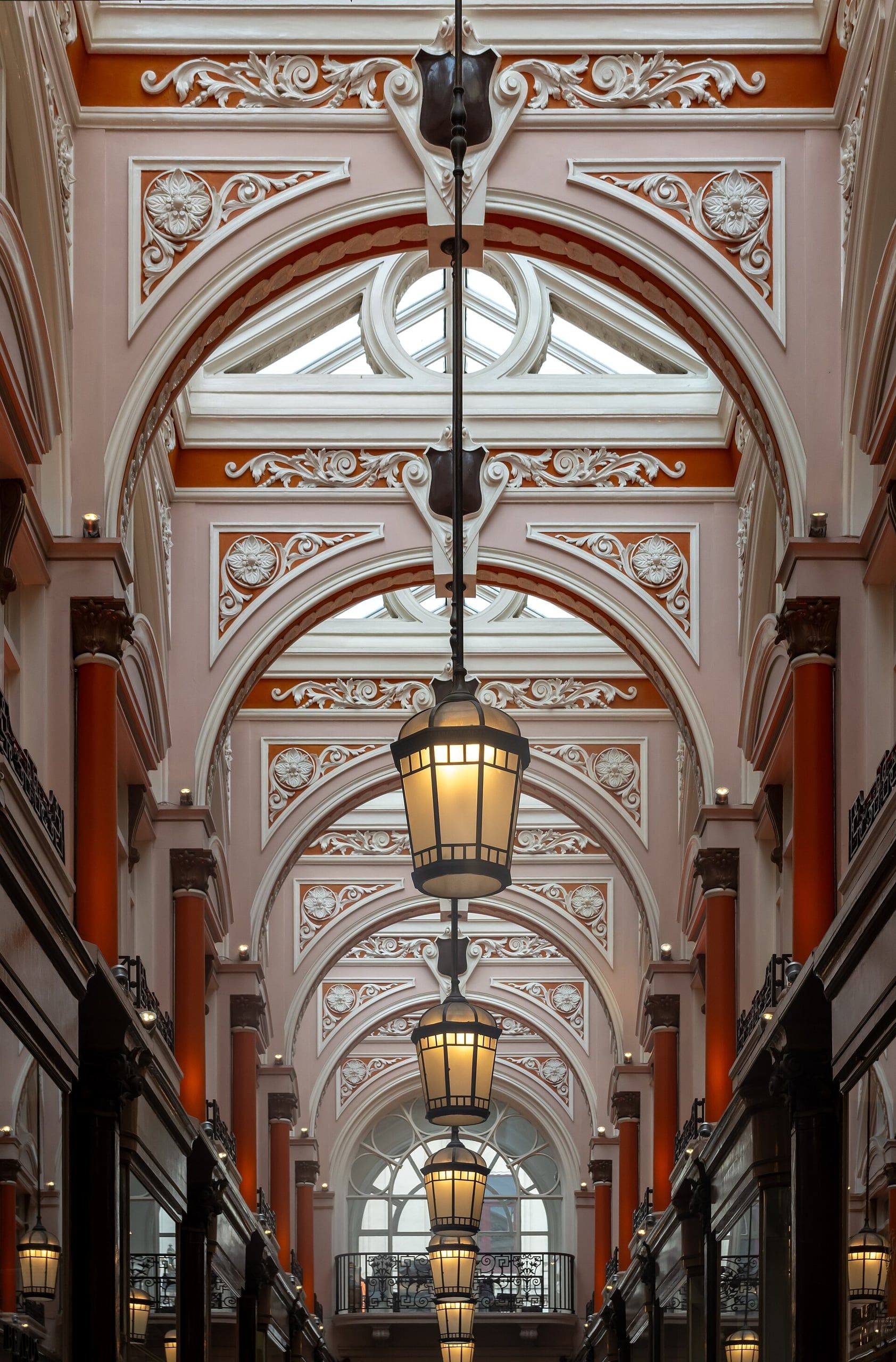 The ornate ceiling and hanging lanterns of the Royal Arcade, a Victorian shopping arcade in Mayfair, London.